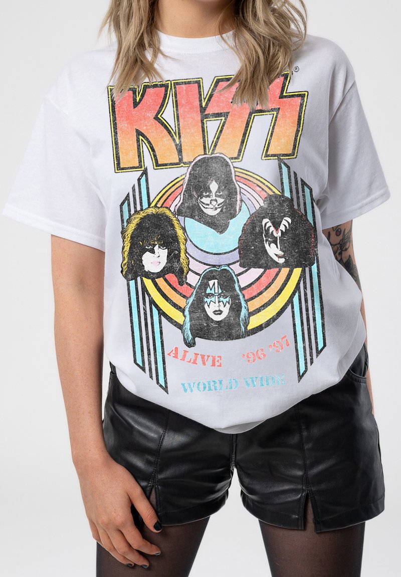 White cotton t-shirt featuring a colorful graphic of four band members, with bold black lettering for "KISS" and retro circular design elements.