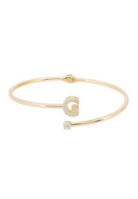 Gold-tone metal bracelet featuring a geometric 'G' adorned with small clear crystals and a single round crystal accent. Simple cuff design.