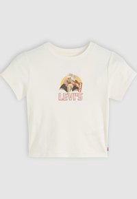 Kreminės spalvos trumpų rankovių marškinėliai su grafiniu spaudiniu, vaizduojančiu du personažus ir raudoną "Levi's" logotipą, apvaliu kaklu ir laisvu siluetu.