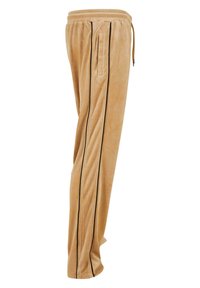 Tan velours joggers met een slim fit, voorzien van zwarte zijstreep en zakken. Elastische tailleband met trekkoord voor een verstelbare pasvorm.