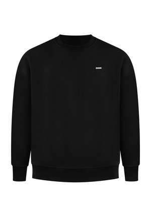 Czarny sweter z okrągłym dekoltem, ściągaczami przy mankietach i u dołu, oraz małą metką z logo na klatce piersiowej. Wykonany z miękkiego materiału o gładkiej teksturze.