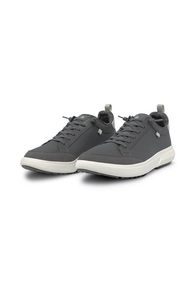 Gray sneakers with a textured fabric upper, white rubber sole, and flat laces. Features a soft lining and a rear pull tab for easy wear.