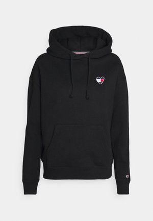 Felpa nera con cappuccio e tasca frontale, con un logo a cuore ricamato in nero, bianco e rosso sul lato sinistro del petto.