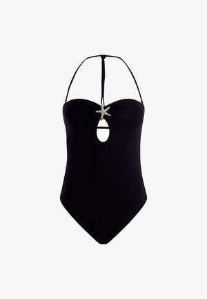 Maillot de bain une pièce noir avec un décolleté en cœur, featuring un accent étoile de mer au centre et une découpe en dessous, bretelles ajustables.
