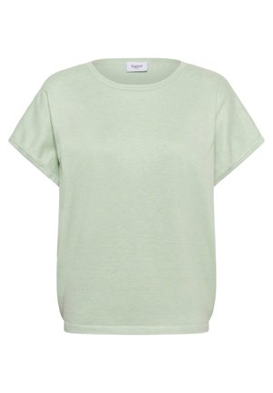 Krátky rukáv, svetlozelený pletený top s okrúhlym výstrihom a voľným strihom, s nápisom "Saint" vo vnútri goliera.