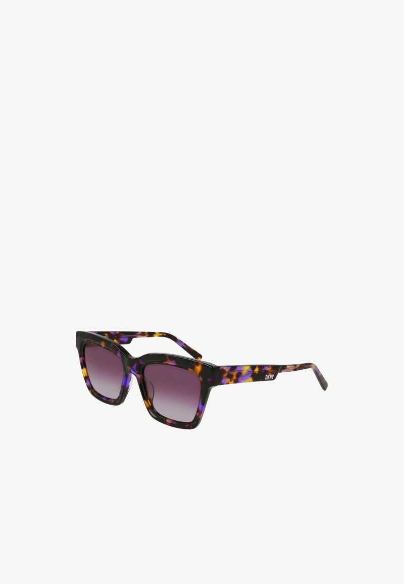 Lunettes de soleil de forme carrée, en plastique noir, avec un motif écaille coloré en violet, orange et jaune. Verres dégradés gris.
