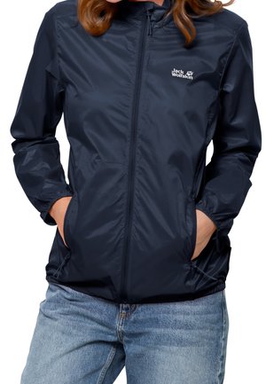 Navy blue lightweight jacket made of smooth, water-resistant material. Features zippered front, elastic cuffs, and side pockets. Brand logo displayed.