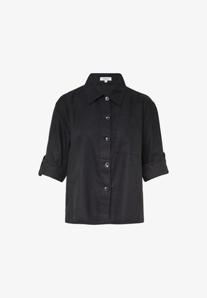 Schwarzes kurzärmliges Leinenhemd mit Kragen, featuring eine Knopf-Frontverschluss und eine Brusttasche. Weiche Textur und aufgerollte Ärmel.
