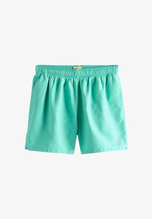 Türkisfarbene Badeshorts mit elastischem Bund und kleinem pinkfarbenem Palmen-Logo auf dem unteren rechten Bein.