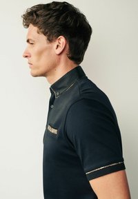 Next SMART COLLAR - Piké - black gold