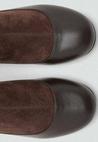 Brown leather and suede shoes with a rounded toe. The front panel features smooth leather, and the midsection has a soft suede texture.