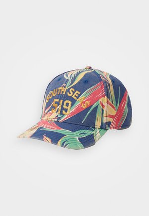 Baseballcap mit navy Hintergrund, der ein farbenfrohes tropisches Blättermuster zeigt. Auf der Vorderseite steht "SOUTH SEAS 519" in gelber Stickerei.
