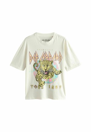White Def Leppard band T-shirt with a roaring leopard graphic and text "Pyromania Tour 1983" on front.