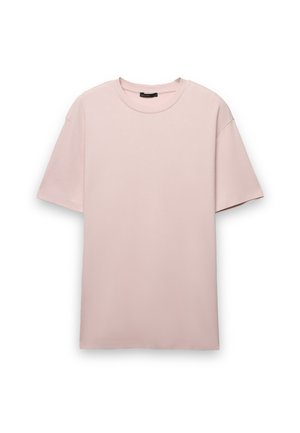 T-shirt rosa chiaro a maniche corte con scollo rotondo, realizzata in tessuto di cotone liscio, con vestibilità rilassata e senza chiusure visibili.