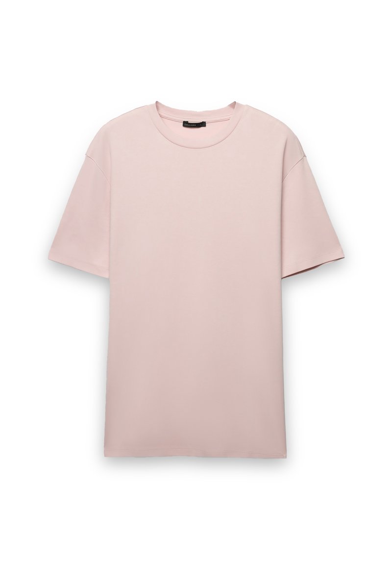 T-shirt rosa chiaro a maniche corte con scollo rotondo, realizzata in tessuto di cotone liscio, con vestibilità rilassata e senza chiusure visibili.