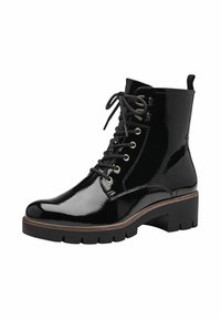 Bottines en cuir verni noir avec un laçage à l'avant, œillets dorés, semelle épaisse et languette à l'arrière.