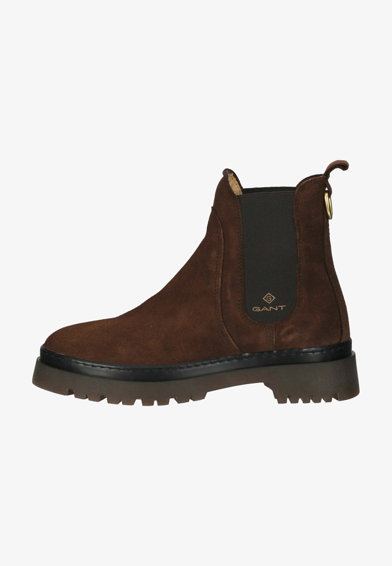 Brown suede Chelsea boot with a rubber sole, elastic side panels, and a pull tab, featuring a small embossed logo on the side.