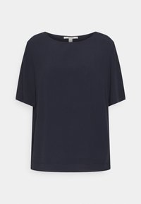 Haut ample bleu marine à manches courtes et col rond. Fabriqué en tissu lisse, présentant des lignes épurées et un ourlet droit.