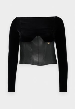 Black long-sleeve top featuring a structured leather bodice with a smooth texture, a wide neckline, and a gold accent on the side.