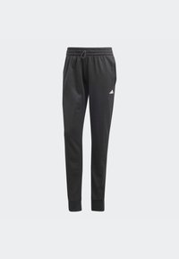 Pantalones deportivos negros con un corte ajustado, cinturilla elástica, cordón ajustable y discreto logo blanco de Adidas en el muslo izquierdo.