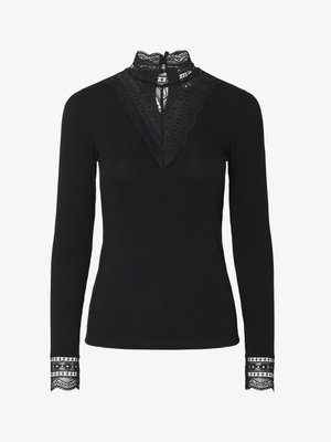 Juodas raukšlėtas viršus su ilgomis rankovėmis ir aukštu nėriniuotų apykakle. Išskirtiniai nėrinių akcentai prie iškirpės ir rankogalių suteikia tekstūros ir detalumo.