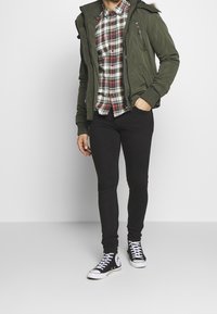 Weekday Vaqueros pitillo - black