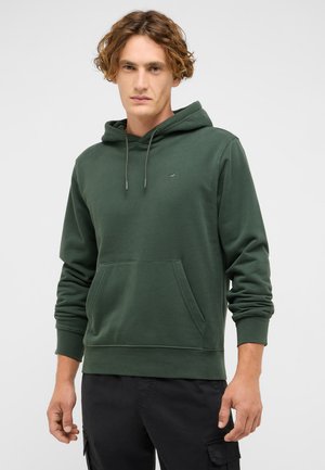 Dark green hoodie made of soft fabric, featuring a kangaroo pocket and drawstring hood. Small logo at the chest, with ribbed cuffs.
