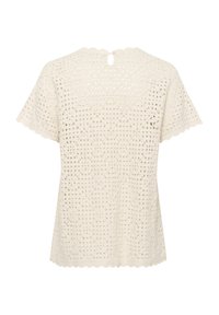 Top in pizzo color crema con maniche corte, caratterizzato da un motivo geometrico e un colletto a scallop. Chiusura a chiave sul retro.