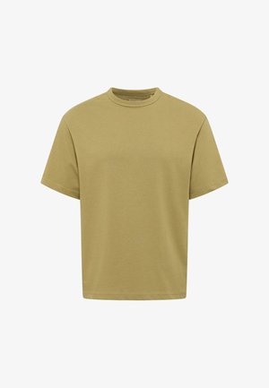 Gładki oliwkowozielony T-shirt z krótkim rękawem, okrągłym dekoltem, luźnym krojem i widocznymi szwami na krawędziach rękawów i na dole.