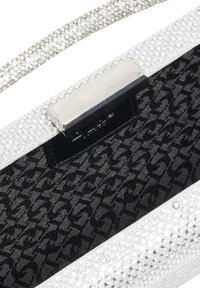 Silver handbag with a textured, sparkling exterior and a black fabric interior featuring a houndstooth pattern and metallic closure.