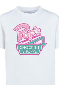 White T-shirt featuring a pink and teal graphic design with the text "Pop's Chock'Lit Shoppe" in a playful font and polka dots.