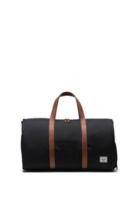 Sort duffel taske med to brune læderhåndtag, rektangulær form, tekstureret stof og et lille mærke på forsiden.