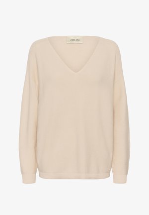 Džemper bež boje od pletenine s V-izrezom, dugim rukavima i rebrastim završecima. Tkanina ima teksturiranu završnu obradu koja pruža mek izgled.