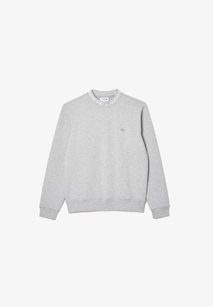 Grijze sweatshirt van zachte stof met een ronde halslijn. Heeft een dikke geribde zoom en manchetten. Klein logo op de borst en merkdetail op de kraag.