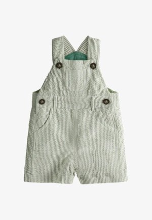 Salopetă de bumbac pentru bebeluși cu dungi verde deschis și alb, cu bretele reglabile și nasturi maro, buzunar pe piept și buzunare laterale.