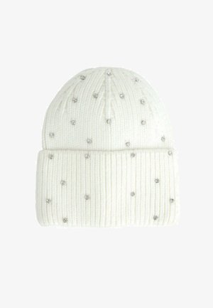 Berretto lavorato a maglia bianco con texture a coste, caratterizzato da brillanti in argento sparsi come decorazione. Orlo piegato alla base per un tocco di stile in più.