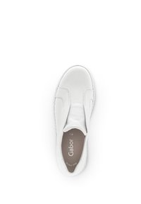 White leather slip-on shoe with a rounded toe and elastic side panels. Features minimal stitching and a textured rubber sole.