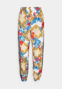 Joggingbyxor i vitt med ett färgglatt blommigt och barockmönster i blått, rött och guld, elastisk midja och svarta sidosträck.