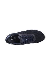 Navy blue sneaker with mesh upper, round toe, flat white sole, and contrasting dark laces. Branding visible inside shoe.
