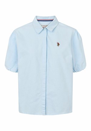 Heledsinine lühikeste varrukatega särk, millel on krae ja nööbid esiplaanil ning vasakul rinnal tikandiga logo. Pehme kangas sileda tekstuuriga.