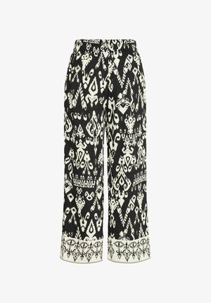 Culottes con motivo in bianco e nero, caratterizzati da una ampia vita elastica e dettagli intricati lungo l'orlo. Realizzati in tessuto testurizzato.