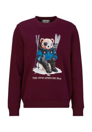 Maroon sweatshirt with a graphic of a bear in ski gear sitting on snow, holding a drink, with skis and poles behind, text below.
