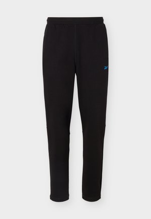 Black athletic track pants with elastic waistband and small blue logo on upper left thigh, displayed against plain light background.