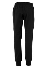 Schwarze Jogginghosen aus weichem Stoff, mit schmalem Schnitt, elastischem Bund und gerippten Abschlüssen für einen sicheren Sitz an den Knöcheln.