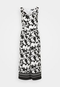Mono sin mangas en blanco y negro con estampado floral, con escote en forma de V y piernas anchas que presentan un dobladillo a rayas.