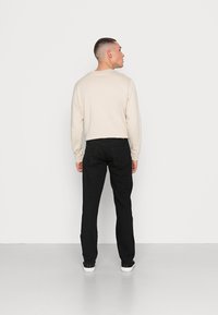 Edwin Ravne kavbojke - black denim
