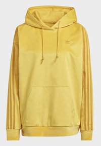 Gul hoodie i manchester med kanguruficka, dragsko i huvan, tre vertikala ränder på ärmarna och en liten logotyp på bröstet.