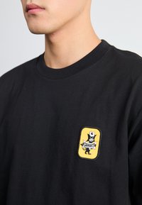 Carhartt WIP SIGNAL - T-shirt imprimé - black