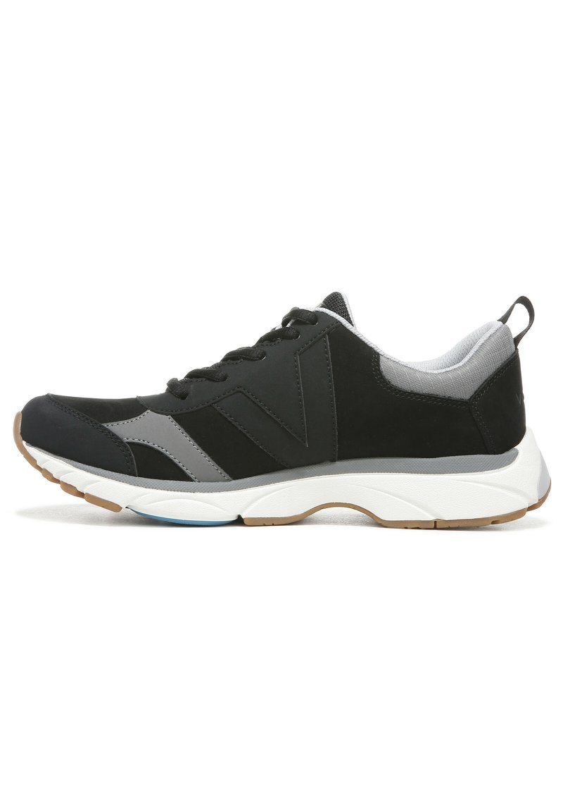 Black athletic shoe featuring a smooth synthetic upper with gray accents, a cushioned white midsole, and a textured rubber outsole.