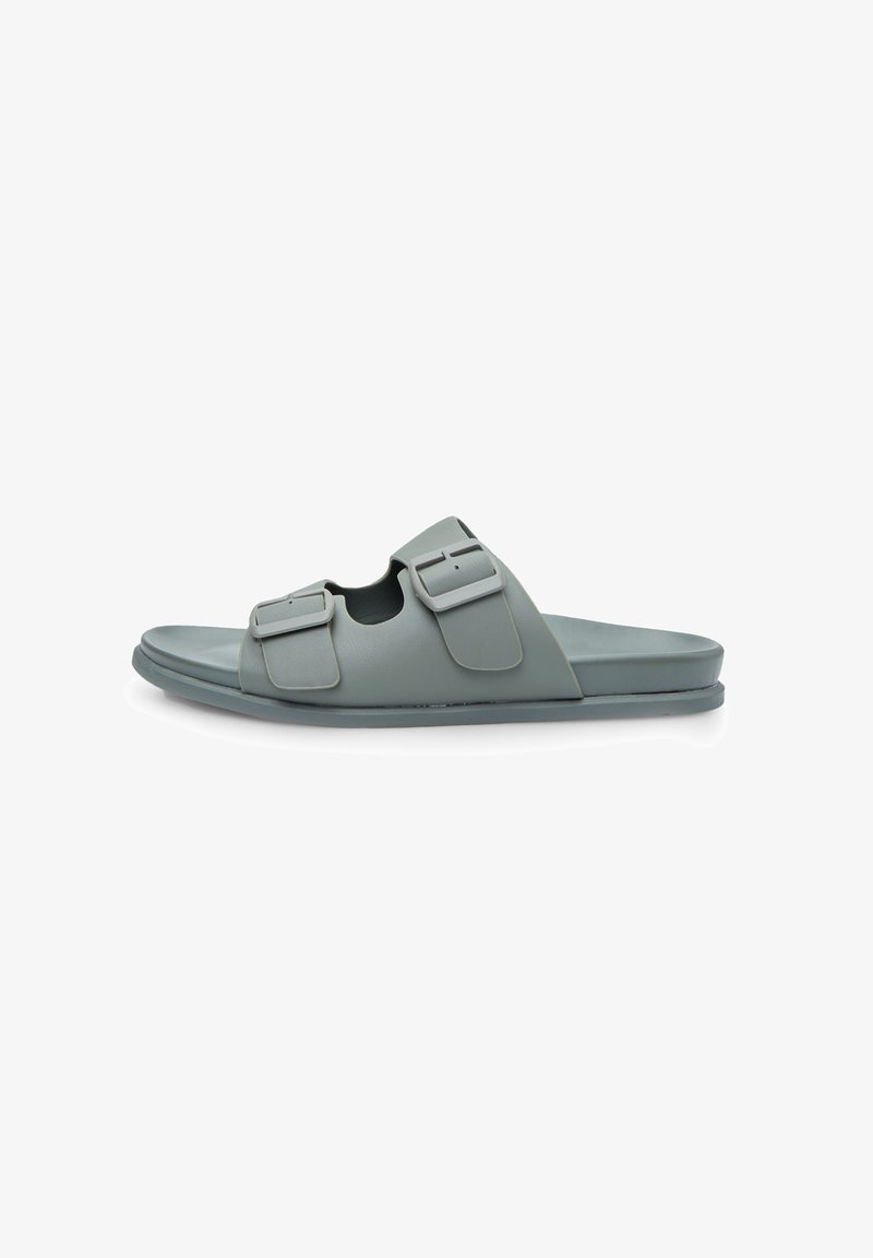 Pelēkā veidota slīdvede ar divām regulējamām sprādzēm, atvērtu purngalu un gludu faktūru. Izstrādāts ikdienas valkāšanai.